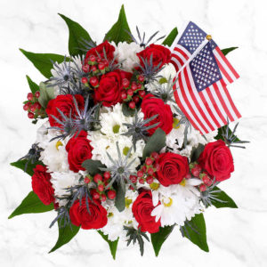 Patriotic Floral Arrangement with a beautiful tribute of blooms in red-white & blue.